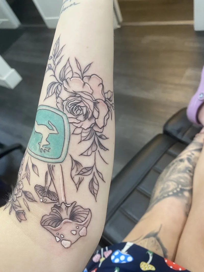Finished tattoo showing fine line and floral work