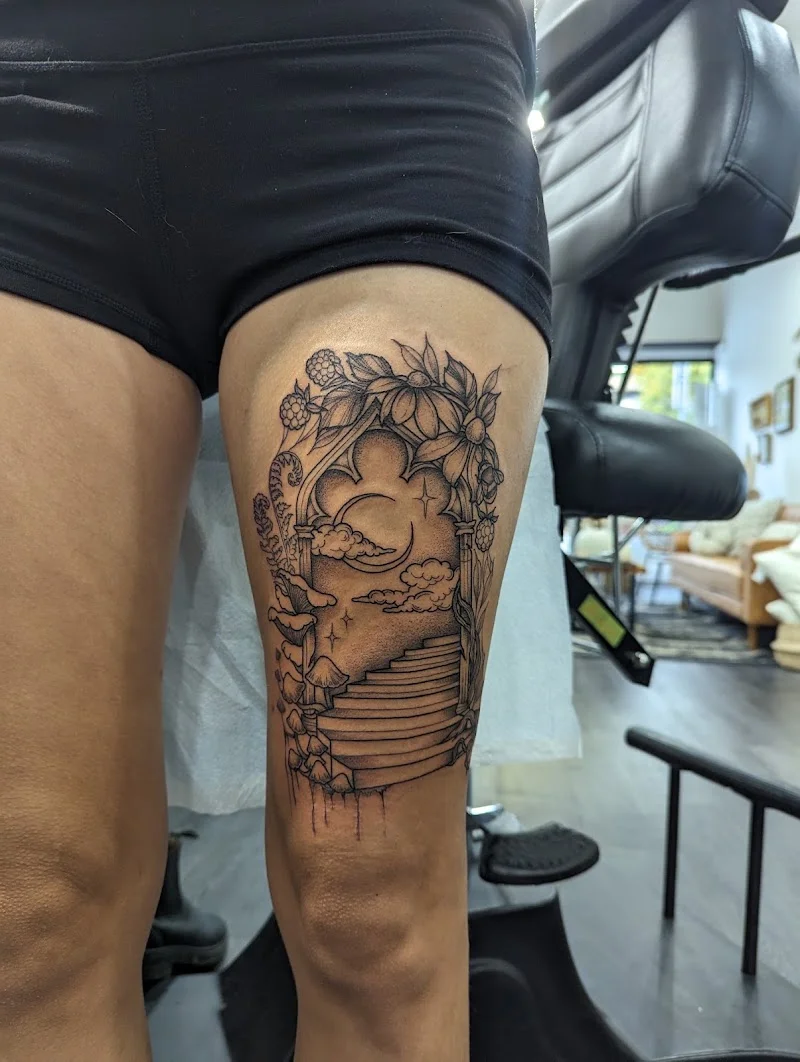 Tattoo studio detail with flash sheets and reference art